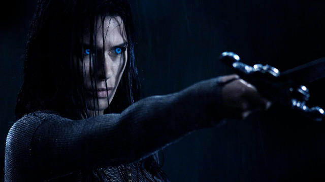 Woman blue eyes gun chains free wallpaper for desktop - medium preview image