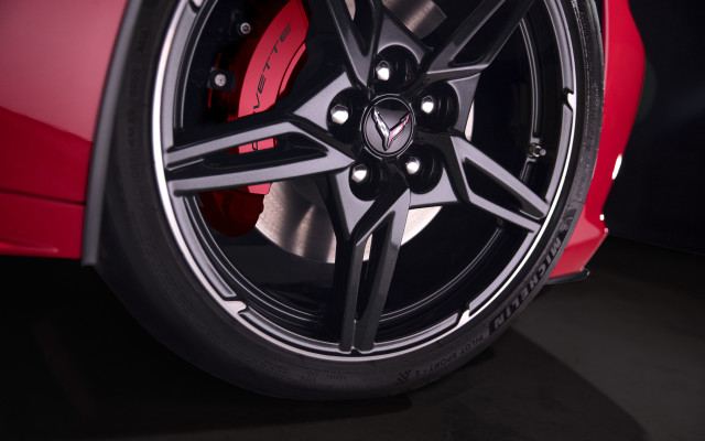 Red car wheel black background free wallpaper for desktop - medium preview image