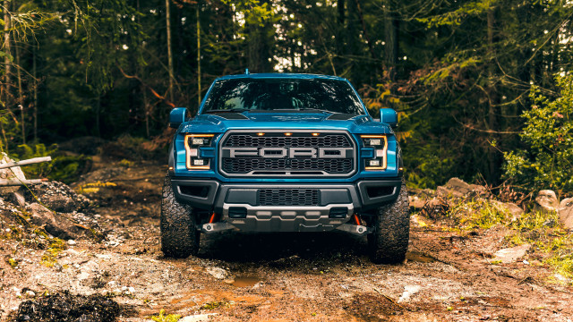 Blue truck forest dirtroad log free wallpaper for desktop - medium preview image