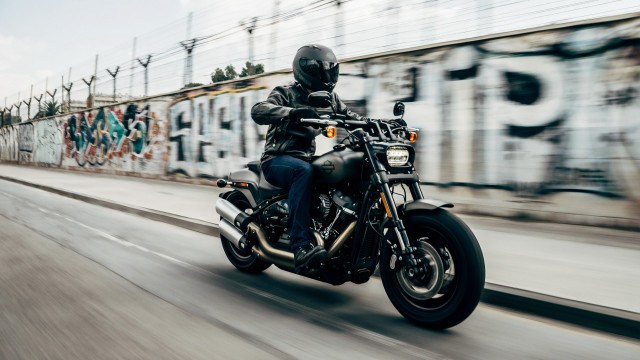 Man motorcycle street graffiti tilt free wallpaper for desktop - medium preview image