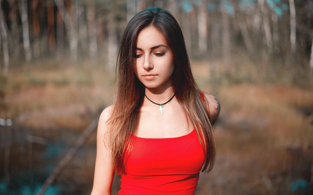 Woman red top forest blurry free wallpaper for desktop - medium preview image