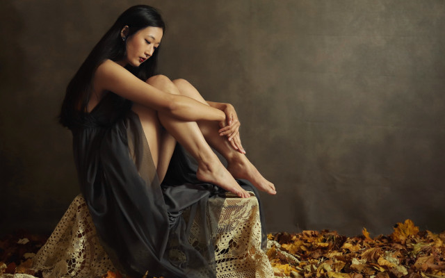 Woman sitting leaves crossed legs free wallpaper for desktop - medium preview image