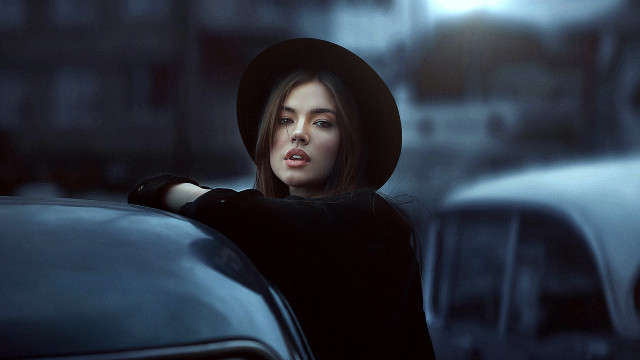 Woman black hat city street #2 free wallpaper for desktop - medium preview image