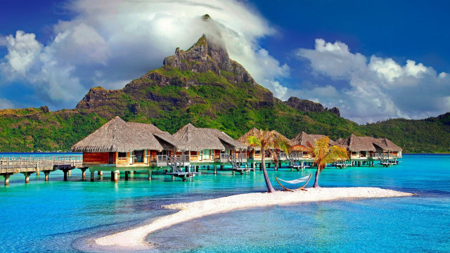 Tropical island dock thatched huts free wallpaper for desktop - medium preview image