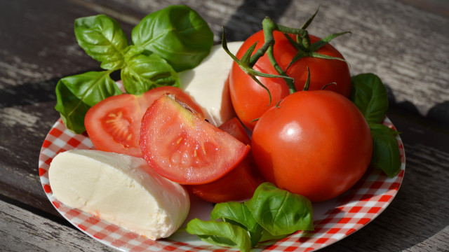 Tomatoes cheese basil wooden table free wallpaper for desktop - medium preview image