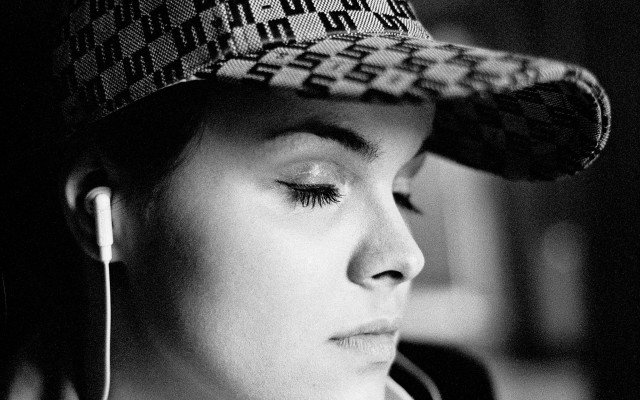 Woman hat earphones closed eyes free wallpaper for desktop - medium preview image