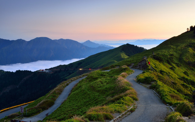 Mountain road clouds hill person free wallpaper for desktop - medium preview image
