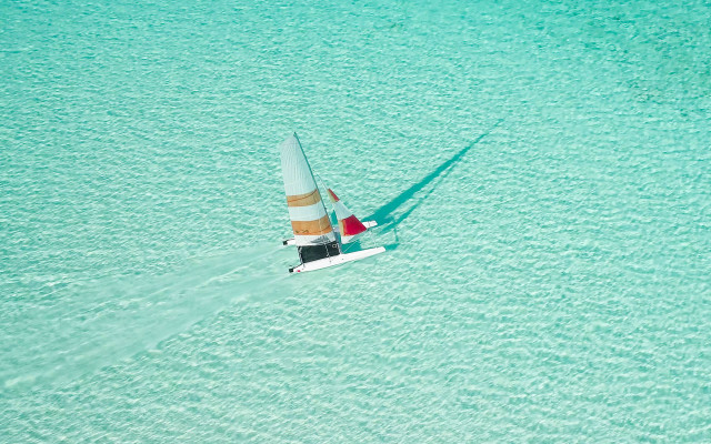 Sailboat blue ocean shadow hyperrealistic free wallpaper for desktop - medium preview image