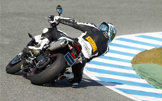 Man riding motorcycle race track free wallpaper for desktop - medium preview image