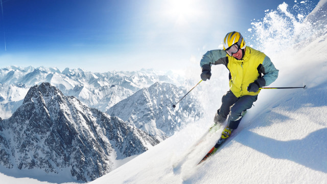 Man skiing snowy slope sunny free wallpaper for desktop - medium preview image