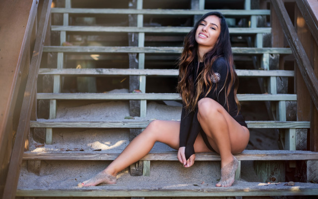 Woman sitting stairs smiling olive free wallpaper for desktop - medium preview image