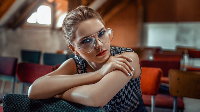 Woman glasses sitting crossed arms free wallpaper for desktop - medium preview image