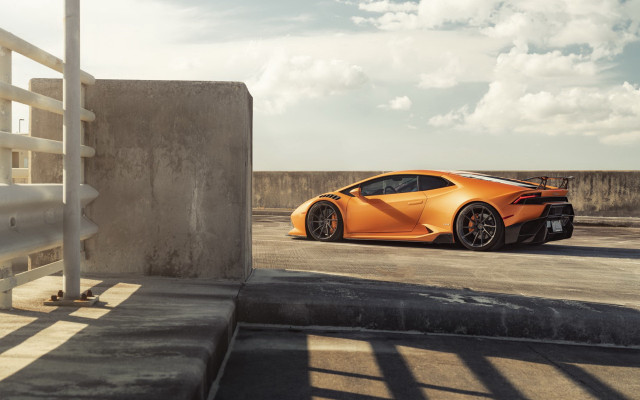 Orange sports car side profile free wallpaper for desktop - medium preview image