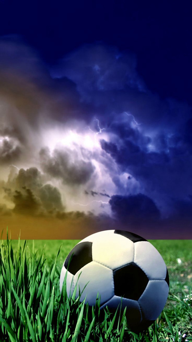 Soccer ball grass cloudy sky free wallpaper for mobile - medium preview image