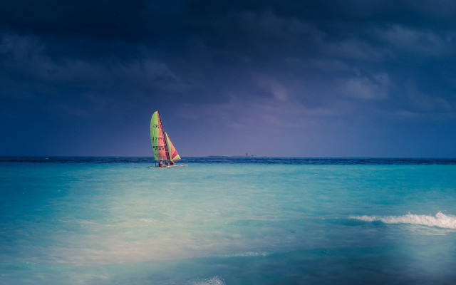 Sailboat ocean cloudy day blue free wallpaper for desktop - medium preview image