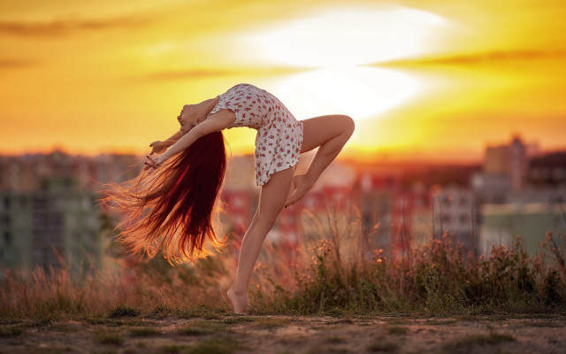 Woman handstand hill sunset blurry free wallpaper for desktop - medium preview image