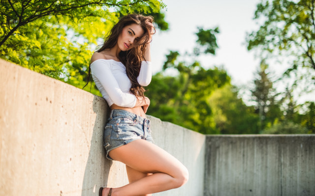 Woman leaning wall crossed legs #4 free wallpaper for desktop - medium preview image