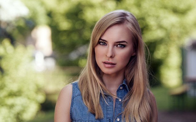 Blonde woman serious portrait bokeh free wallpaper for desktop - medium preview image