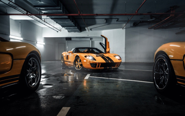 Orange sports cars parking garage free wallpaper for desktop - medium preview image