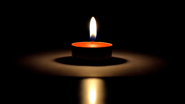 Lit candle reflection black background free wallpaper for desktop - medium preview image