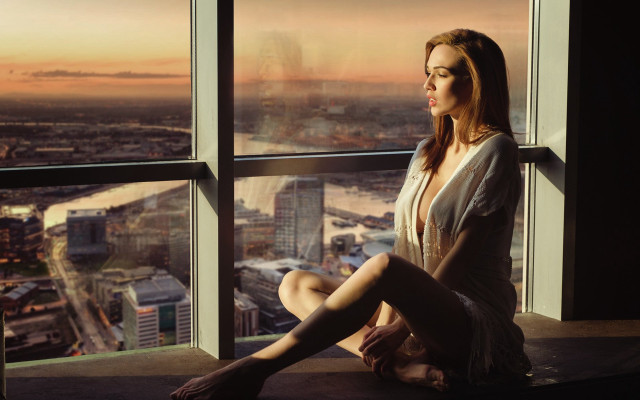 Woman sitting window sill city #3 free wallpaper for desktop - medium preview image