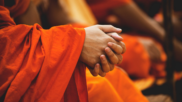 Couple holding hands orange robes free wallpaper for desktop - medium preview image