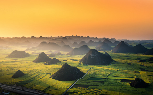 Green grass yellow sky mountains free wallpaper for desktop - medium preview image