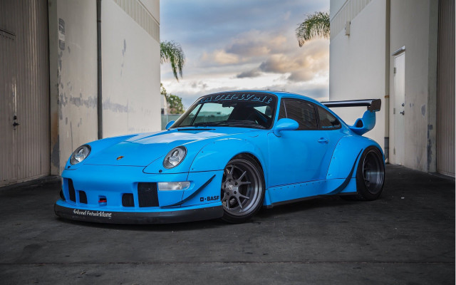 Blue sports car garage palm free wallpaper for desktop - medium preview image