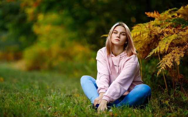 Woman sitting field blurry nature #2 free wallpaper for desktop - medium preview image