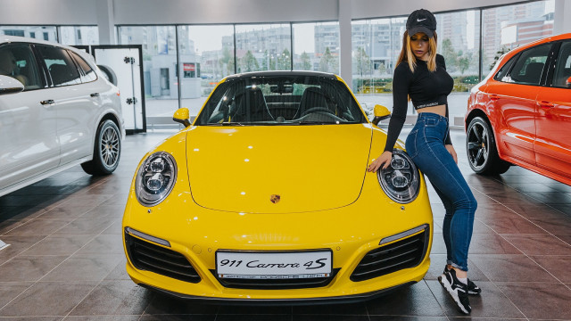 Woman porsche showroom blonde helmet free wallpaper for desktop - medium preview image