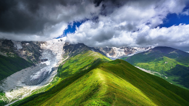 Mountain range green field cloudy free wallpaper for desktop - medium preview image