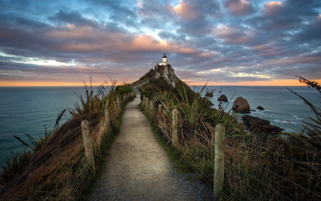 Lighthouse path cliff ocean sunset free wallpaper for desktop - medium preview image