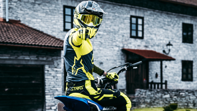 Motorcycle man yellow black outfit free wallpaper for desktop - medium preview image
