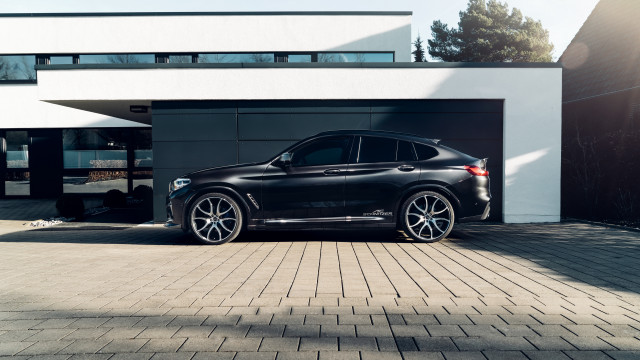 Black car building white roof free wallpaper for desktop - medium preview image