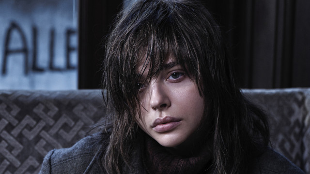 Woman longhair couch serious blackbackground free wallpaper for desktop - medium preview image