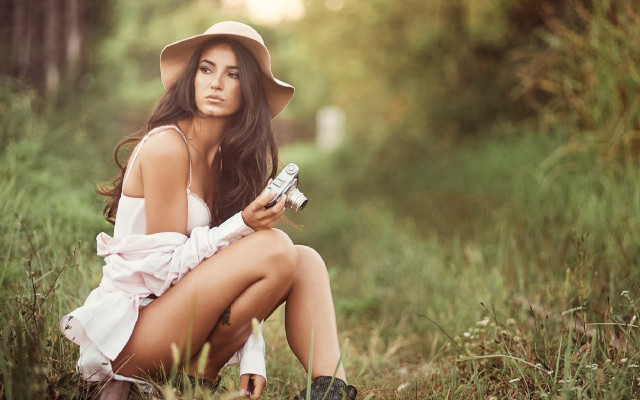 Woman hat sitting grass phone free wallpaper for desktop - medium preview image