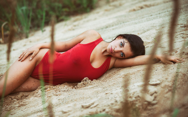 Red swimsuit beach laying blurry free wallpaper for desktop - medium preview image