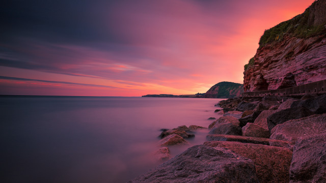 Sunset ocean rocks cliff landscape free wallpaper for desktop - medium preview image