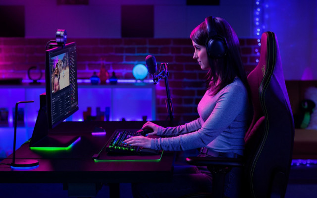 Woman sitting desk computer headphones free wallpaper for desktop - medium preview image