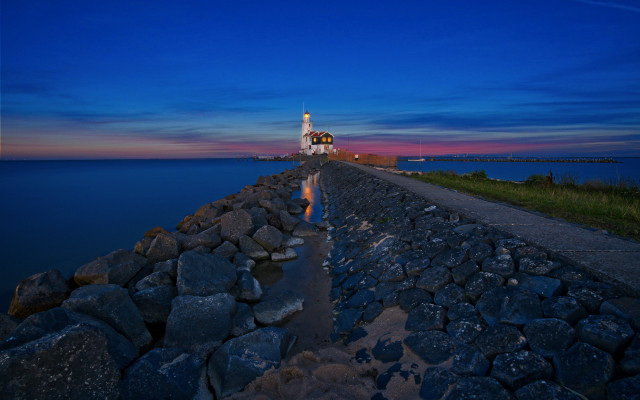 Lighthouse rocky shore dusk reflection free wallpaper for desktop - medium preview image