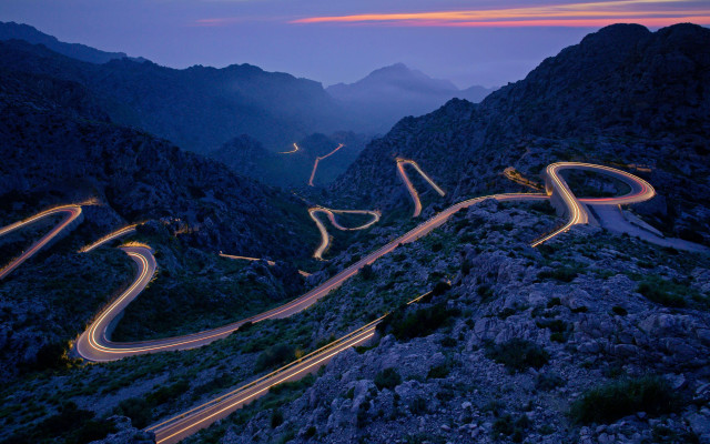 Winding road lights mountains night free wallpaper for desktop - medium preview image