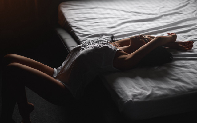 Woman laying bed dark room free wallpaper for desktop - medium preview image