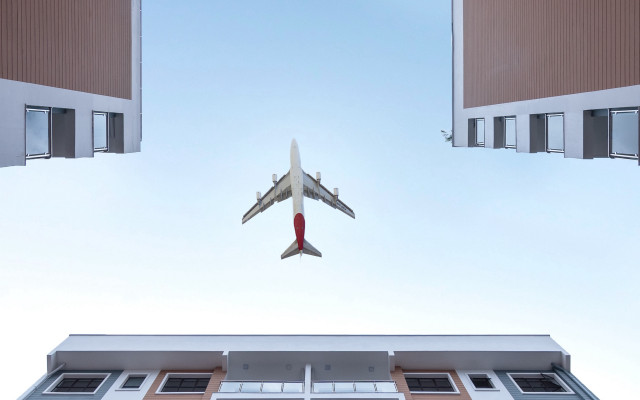 Airplane building sky minimalism tiltshift free wallpaper for desktop - medium preview image
