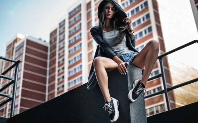 Woman ledge sitting hooded sneakers free wallpaper for desktop - medium preview image
