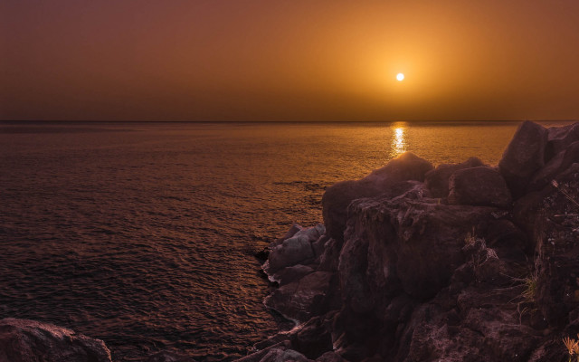 Sunset ocean boat rock anamorphic free wallpaper for desktop - medium preview image