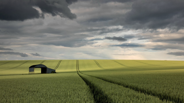 Barn field cloudy sunset horizon free wallpaper for desktop - medium preview image