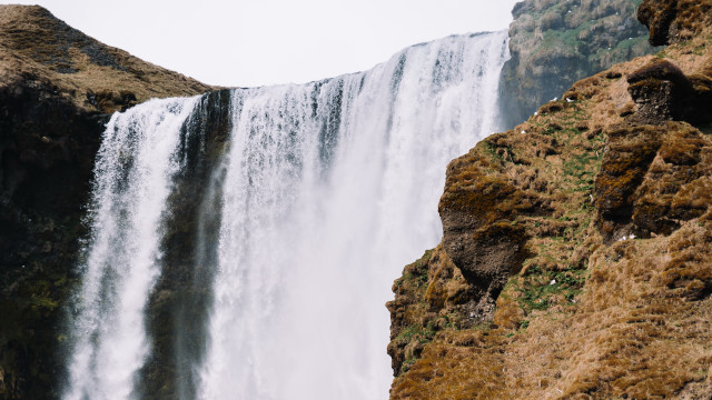 Waterfall man cliff bird nature free wallpaper for desktop - medium preview image