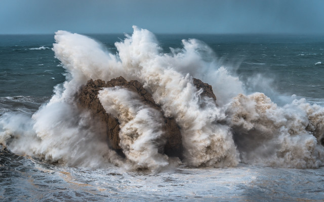 Large wave crash over rock free wallpaper for desktop - medium preview image