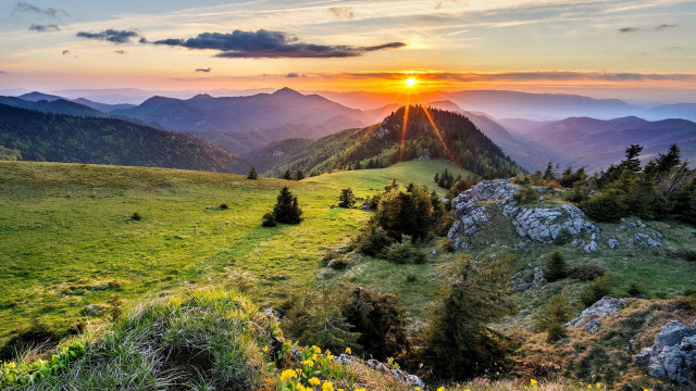 Sunset mountain range grassy field #2 free wallpaper for desktop - medium preview image