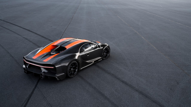 Black orange sportscar racetrack tiltshift free wallpaper for desktop - medium preview image